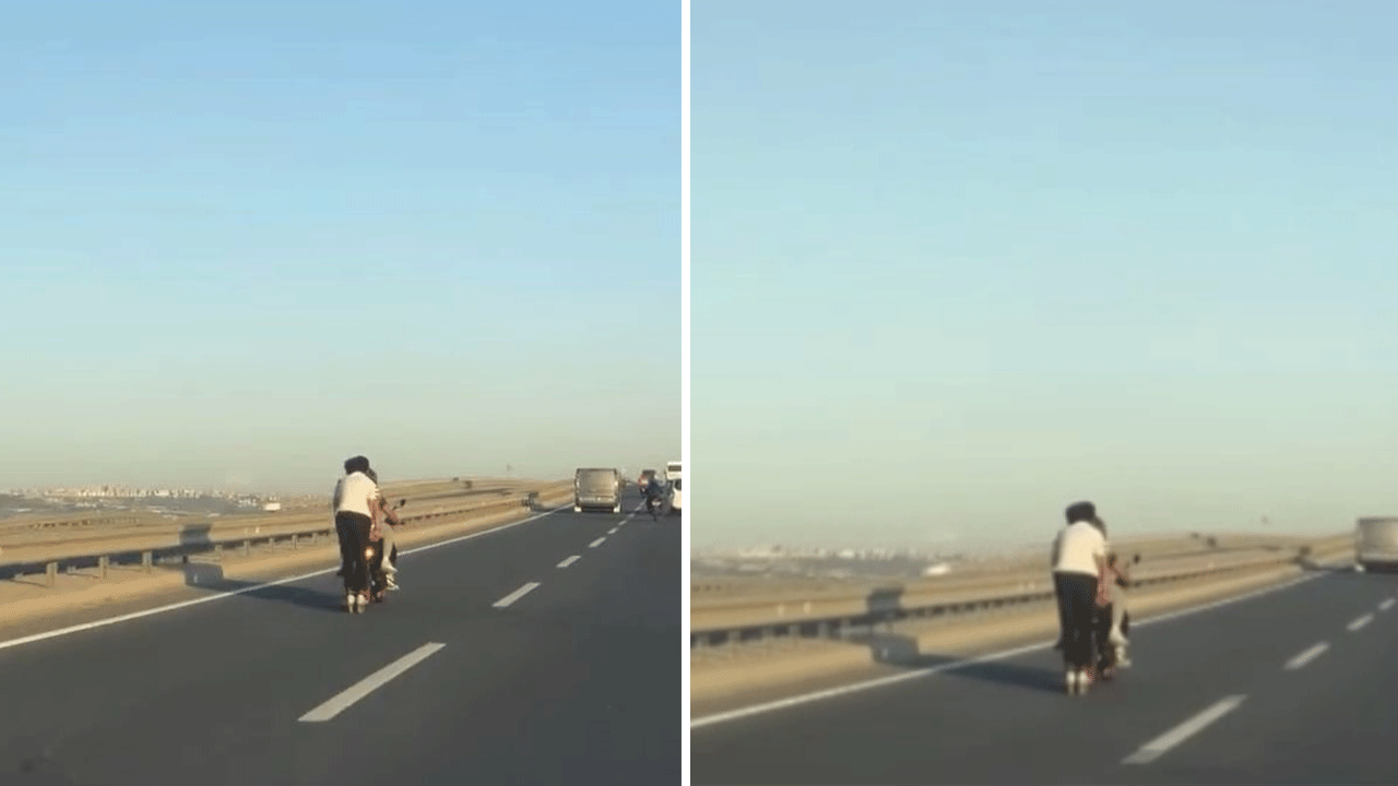 Otobanı motosikleti tutarak geçti! Yürekleri ağza getirdi